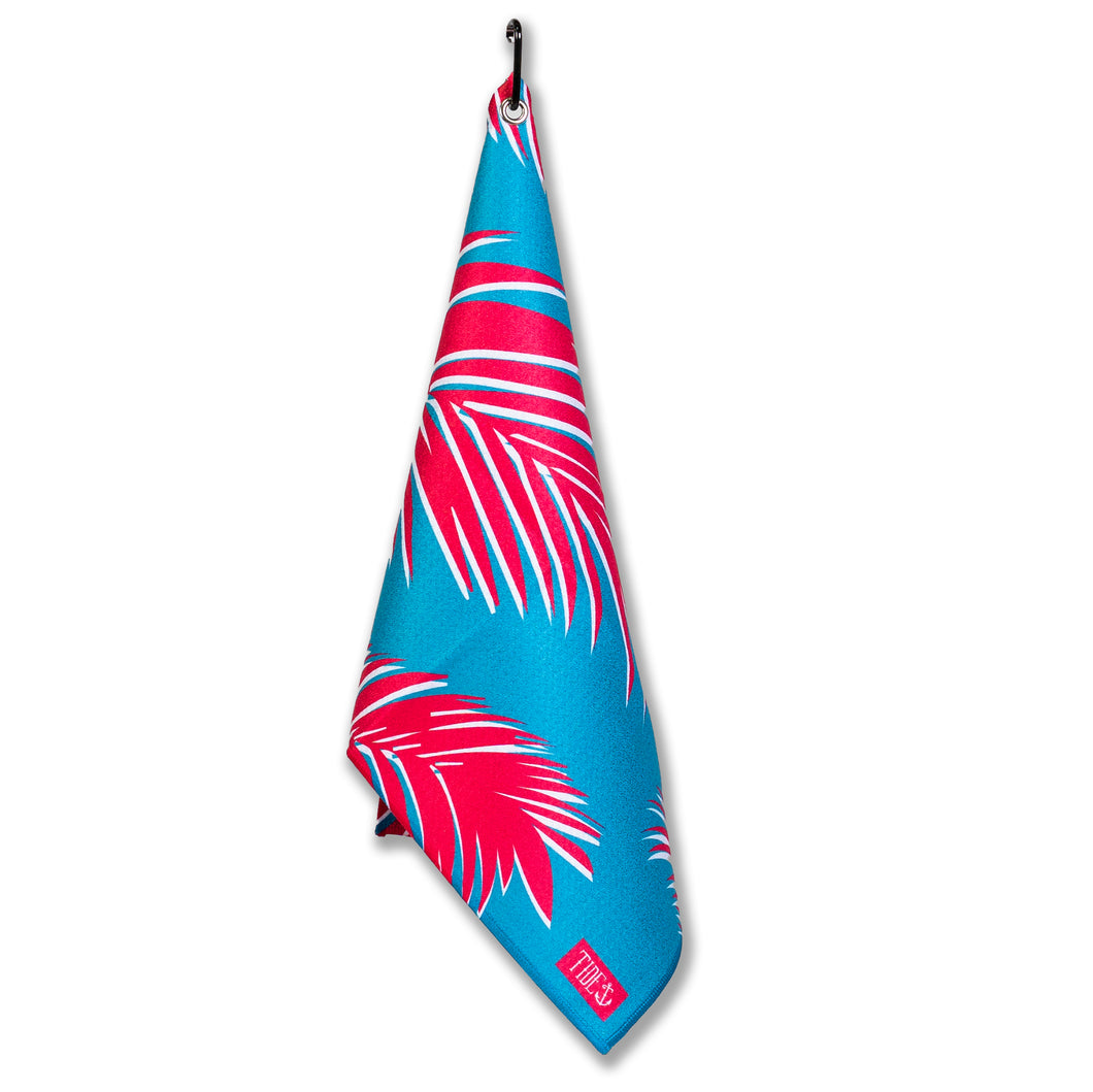 Troppo Multi-Purpose Towel in blue with pink palm leaves, ideal for fishing, boating, and outdoor use.